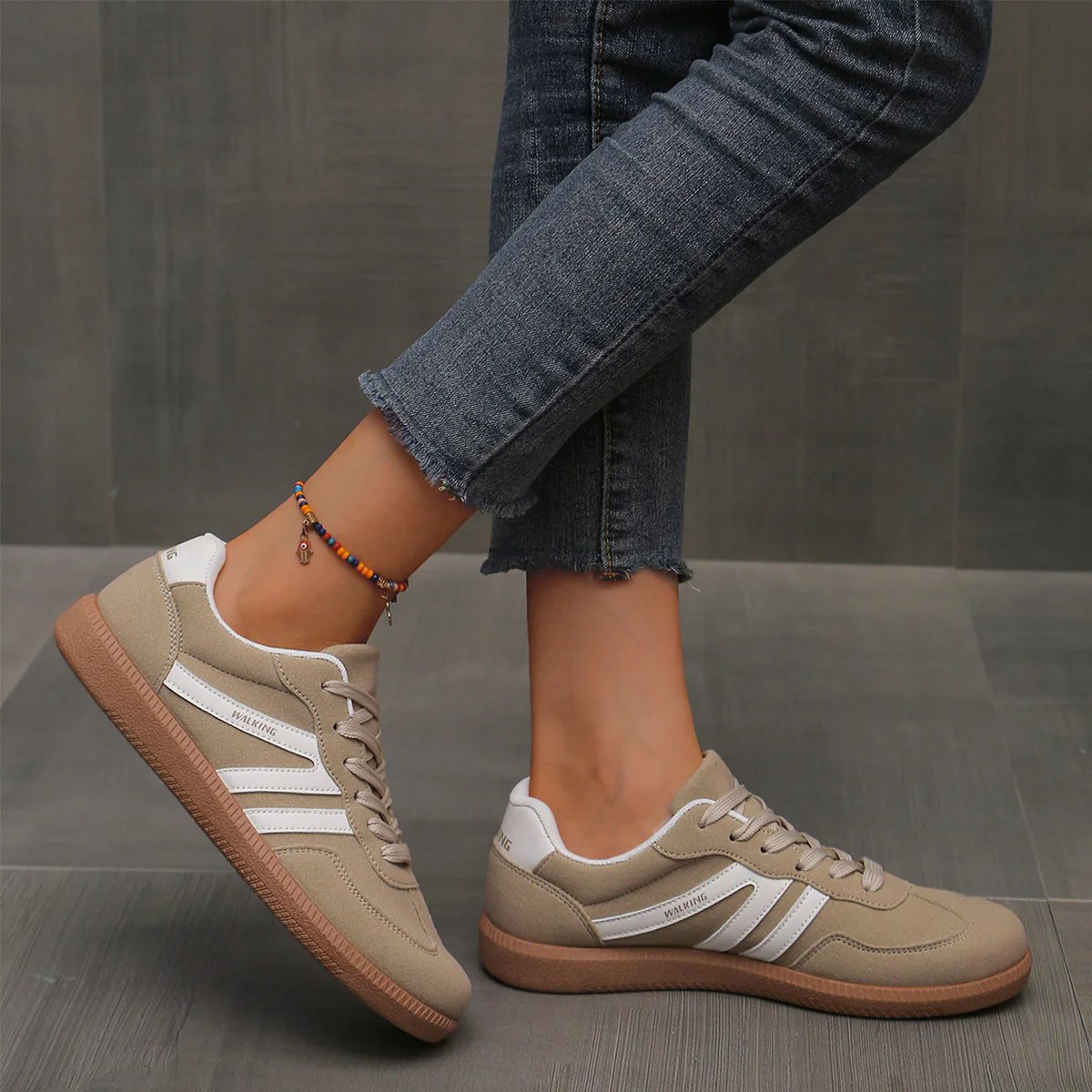 Briony Orthopaedic Cushioned Trainers in beige khaki suede with white stripes, worn on foot - The Gold Coast Family