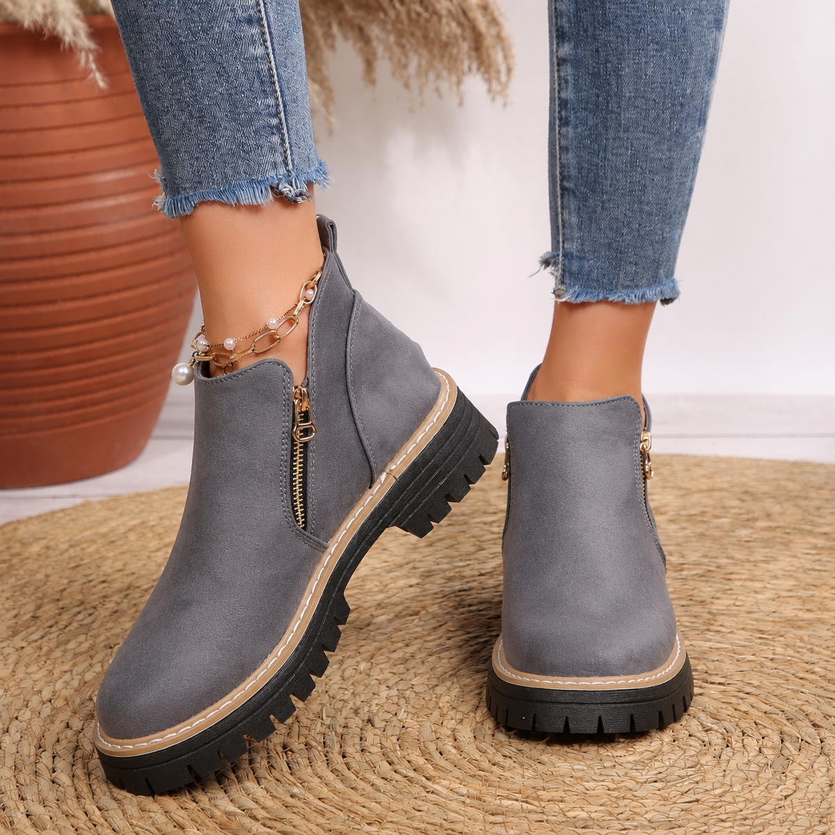 Robyn Comfort Ankle Boots in grey suede with side zipper, worn on both feet - The Gold Coast Family