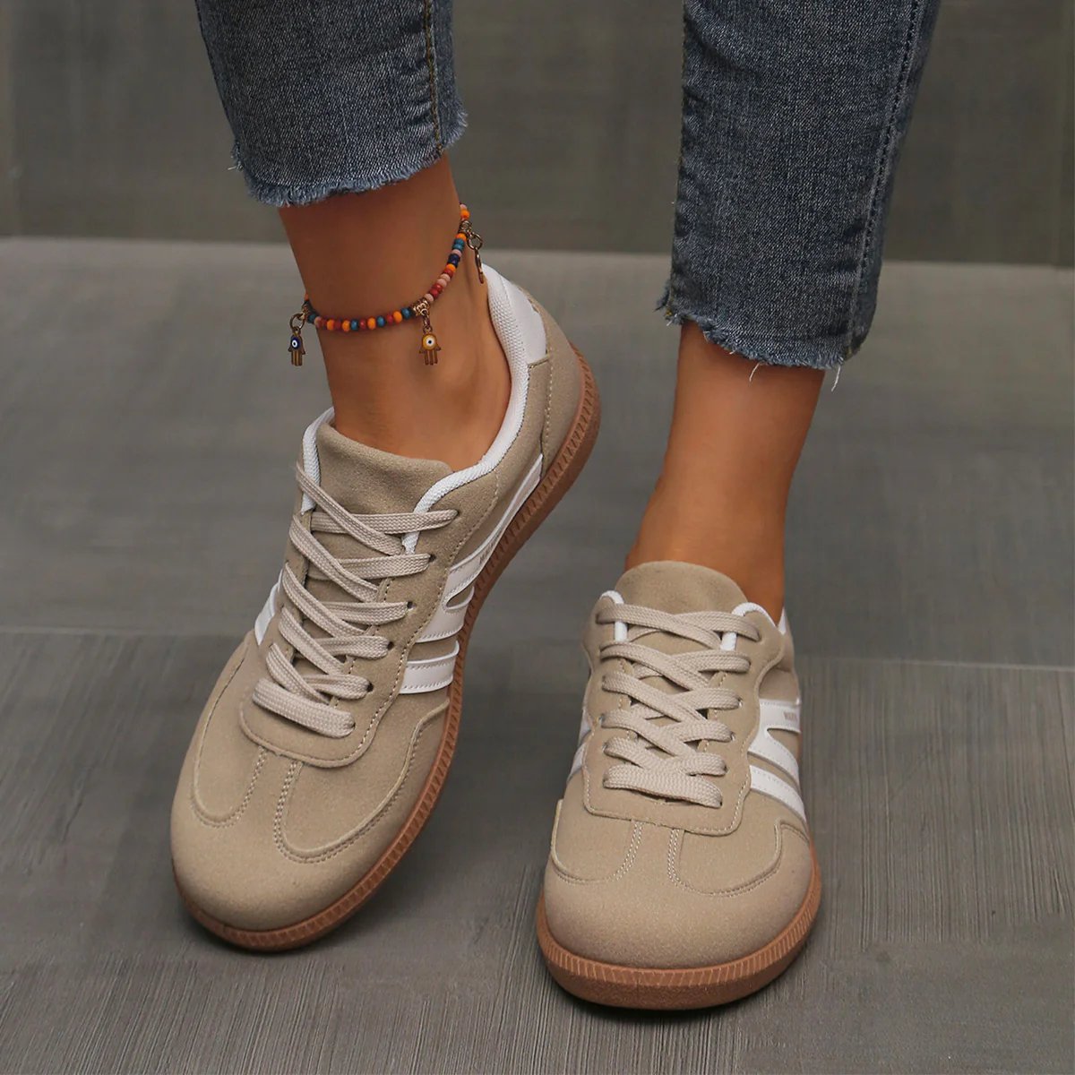 Briony Orthopaedic Cushioned Trainers in beige suede with white stripes, worn on foot - The Gold Coast Family