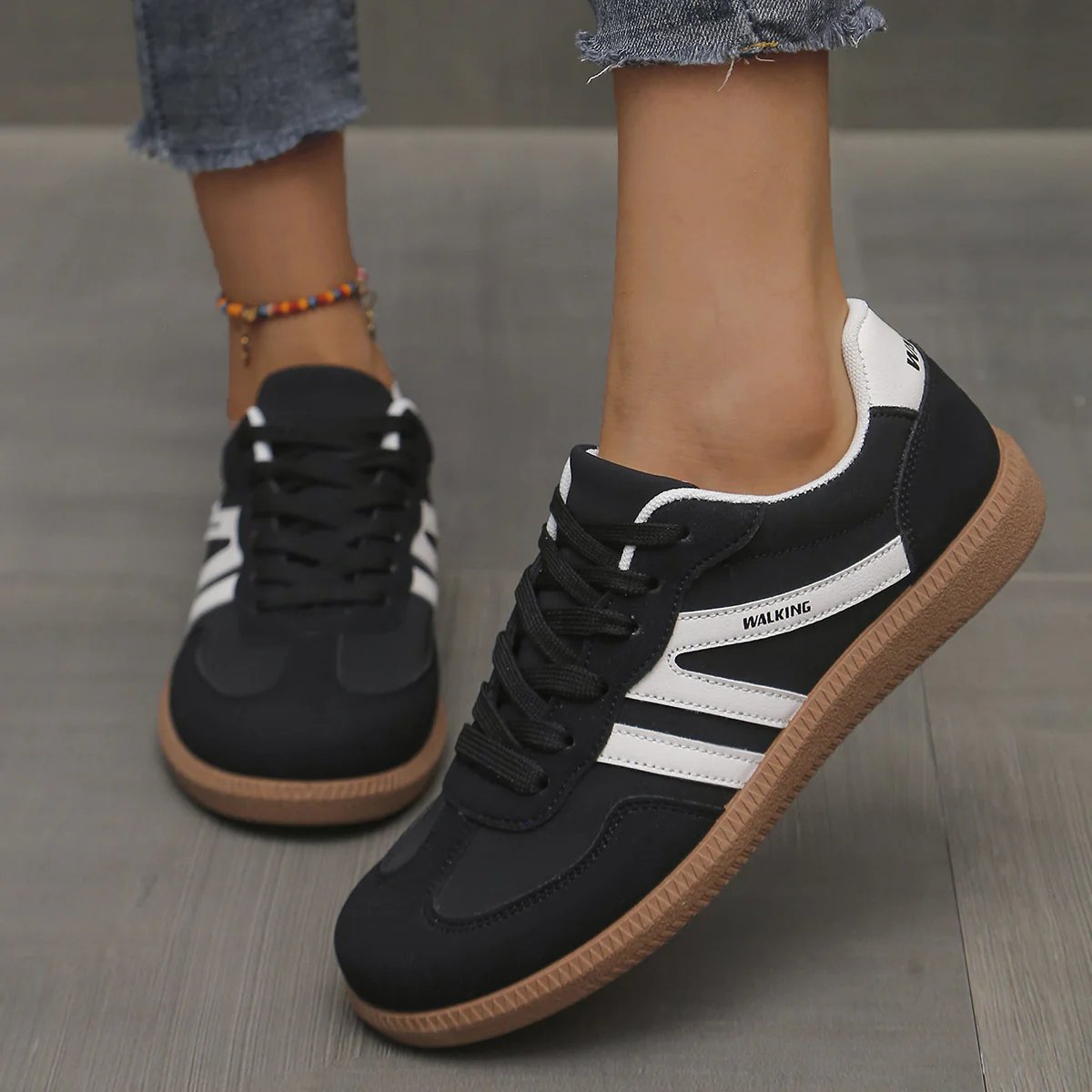 Briony Orthopaedic Cushioned Trainers in black and white stripe, worn on foot - The Gold Coast Family