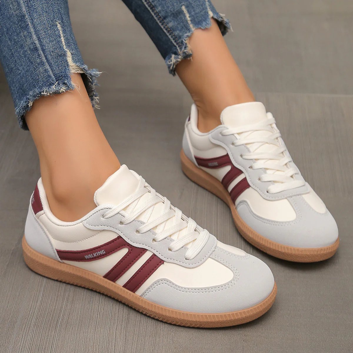Briony Orthopaedic Cushioned Trainers in white and grey with burgundy stripe, worn on foot - The Gold Coast Family