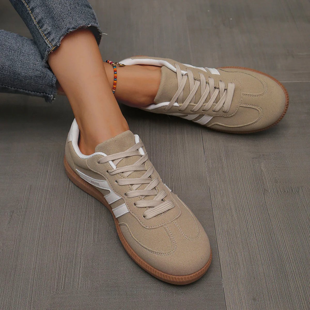 Briony Orthopaedic Cushioned Trainers in beige suede with white stripe, worn on foot - The Gold Coast Family