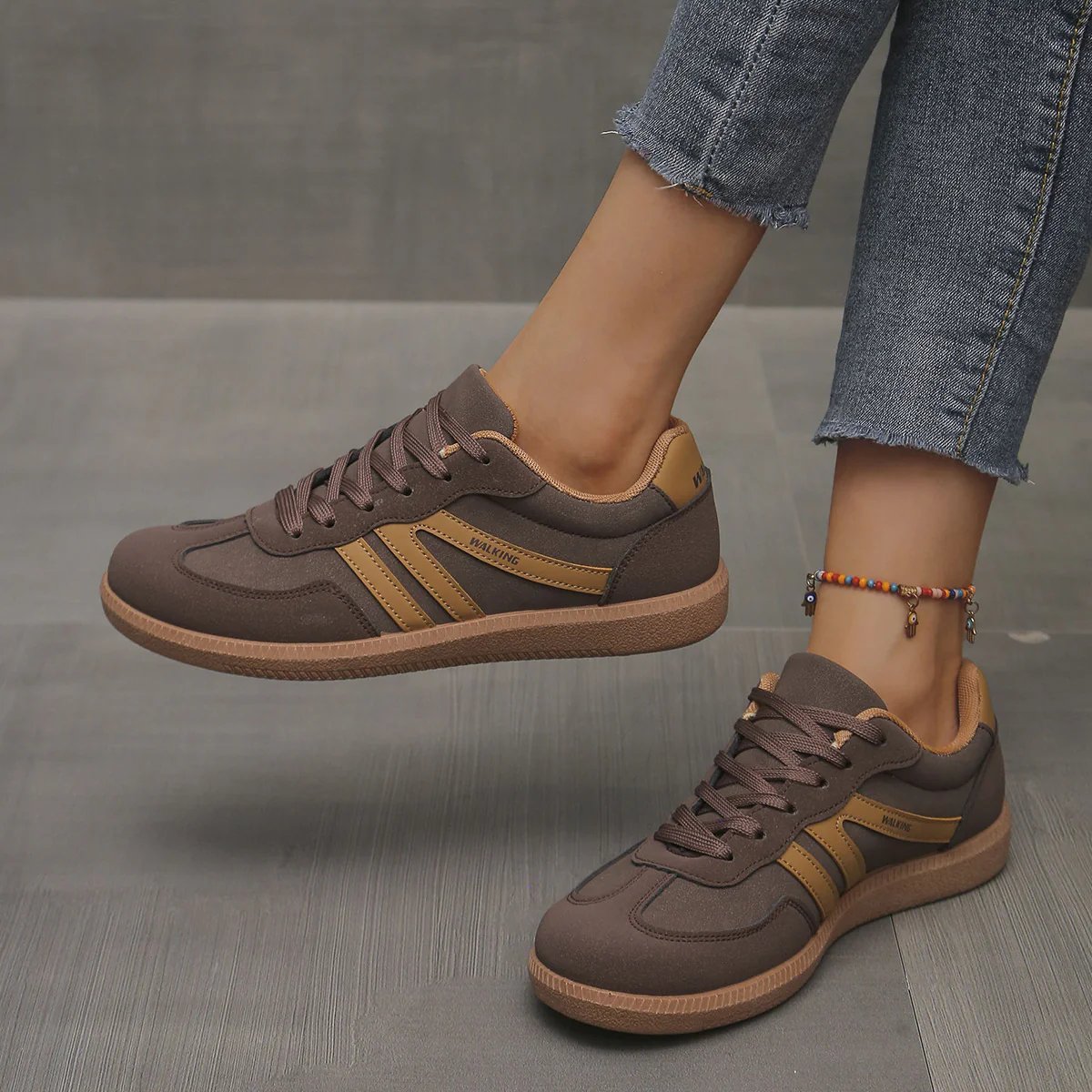 Briony Orthopaedic Cushioned Trainers in brown taupe with mustard gold stripes, worn on foot - The Gold Coast Family