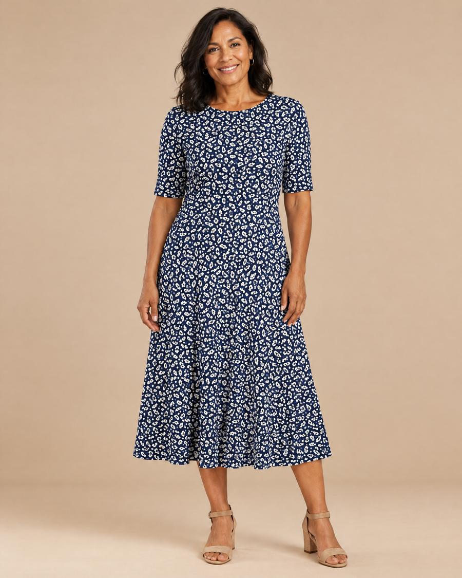 aisha effortless floral midi dress in a light beige studio