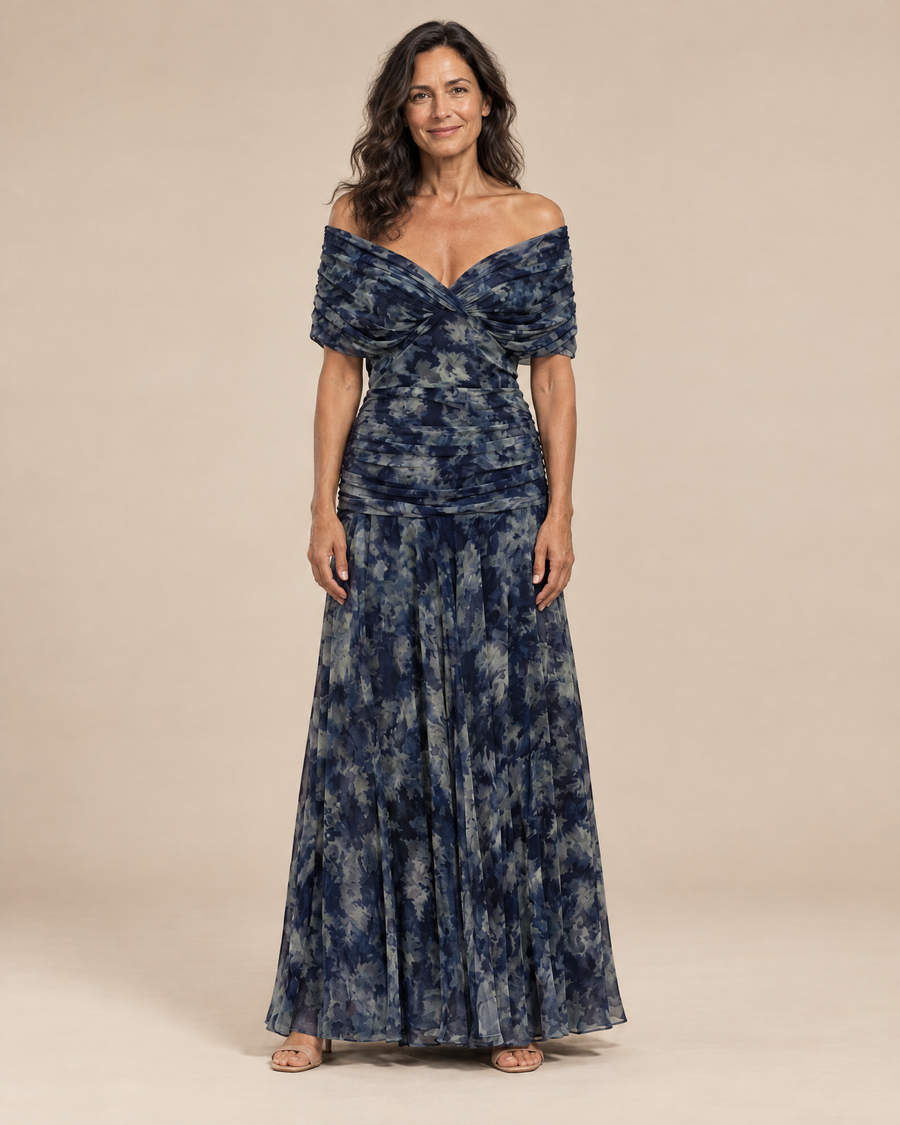 navy watercolour print dress in a light beige studio